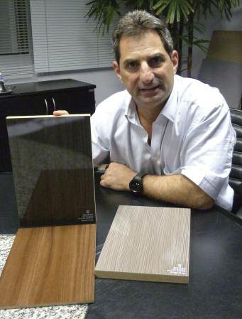Eucatex's executive president with some finished products including high-gloss MDF