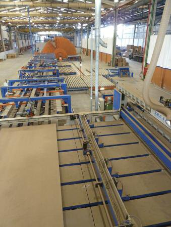 A view of the EMG-supplied saw, handling and finishing sections of Eucatex's new MDF/HDF line, prior to its launch at Salto