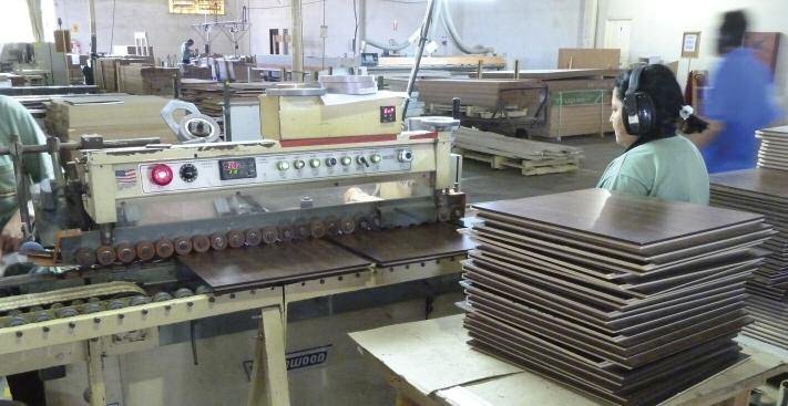 Furniture component edges are prepared and foiled in a Vorwood L110 Edge Foiler line